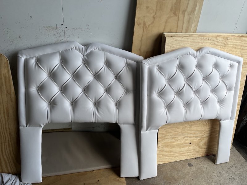 Two white diamond button-tufted headboards freshly upholstered